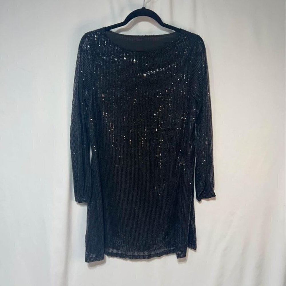 Woman’s black sequined cocktail dress. Long sleeve. Lined. Size Medium.